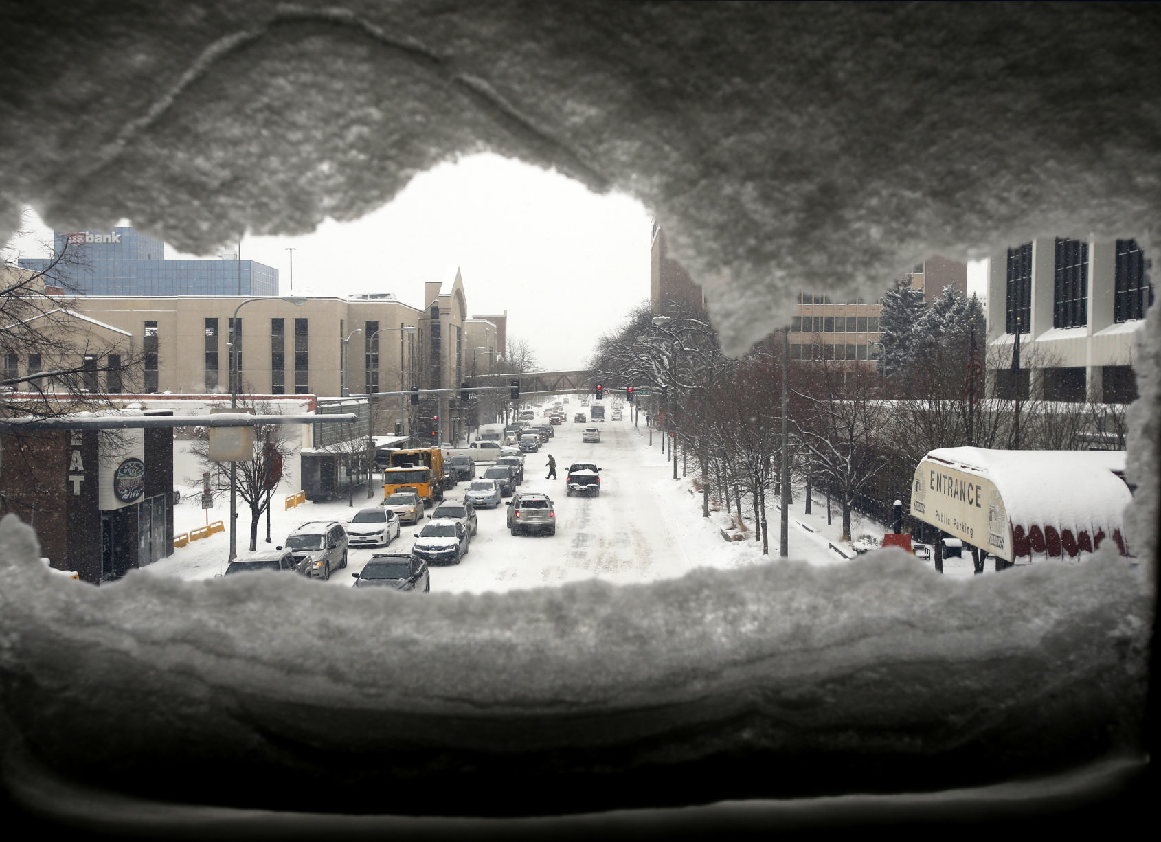 Snow partially covers the pedestrian walkway